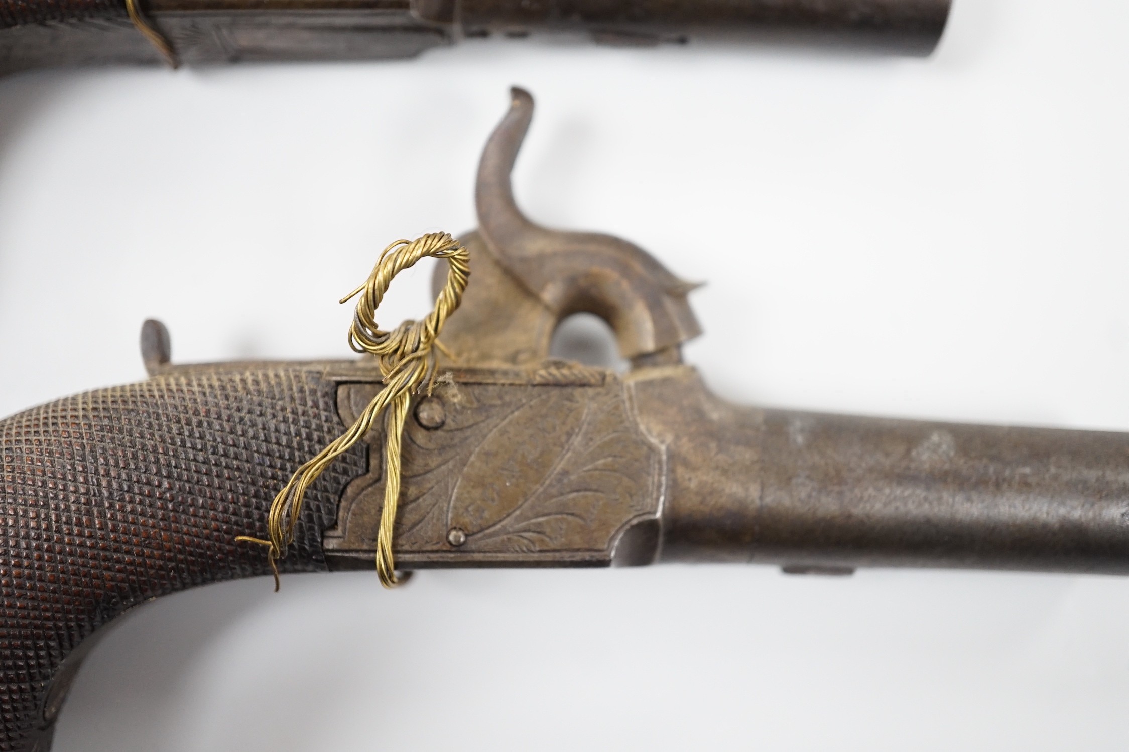 A pair of 19th century Smith of London percussion cap muff pistols, 12.5cm